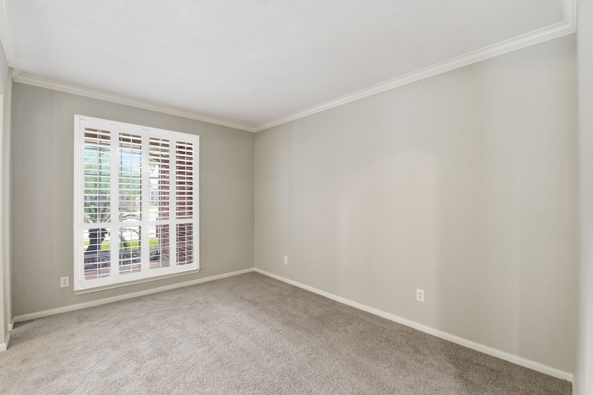 3414 Hackberry Court Spring, TX 77388 - Photo 6 of 50 This is the formal living room to the left as you enter the home. Notice the recently replaced carpet, the fresh paint, the white shutters and the crown molding!