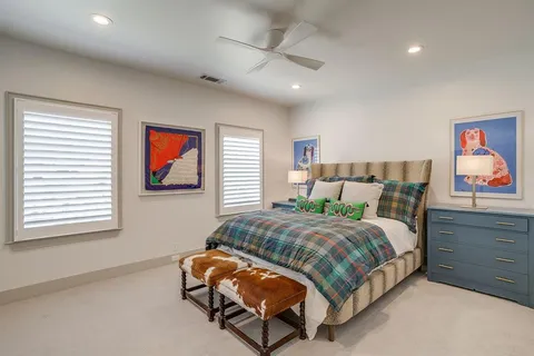 a bedroom with a bed and dresser