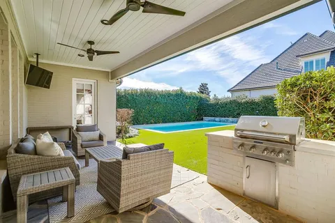 a view of a patio with swimming pool