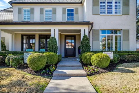 a view of a building with a garden