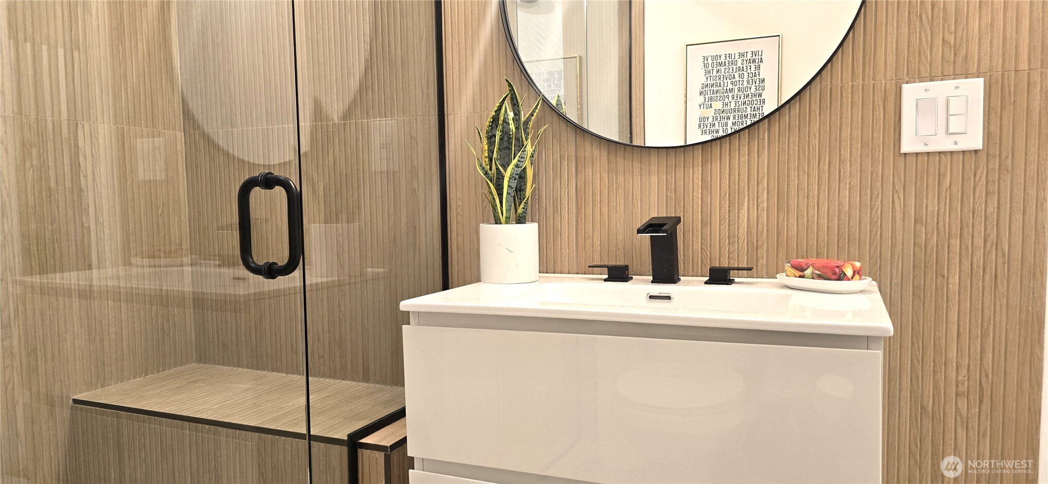 8421 39th Avenue Southwest Seattle, WA 98136 - Photo 17 of 24 a bathroom with a sink a mirror a vanity and a shower