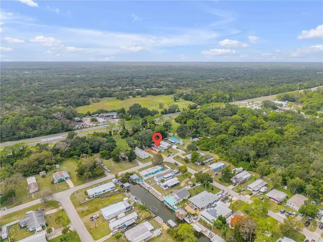 an aerial view of residential building and lake