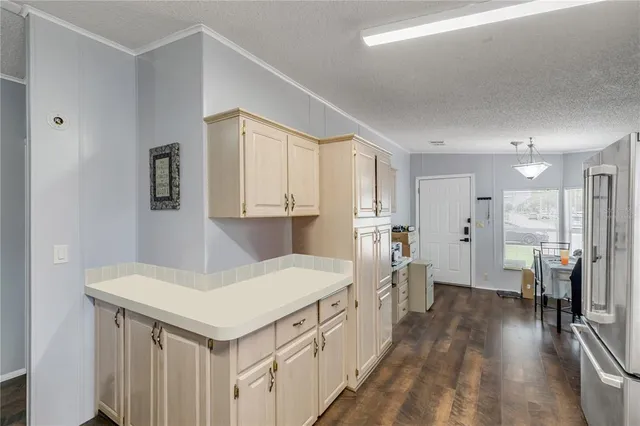 a kitchen with a sink stove and refrigerator