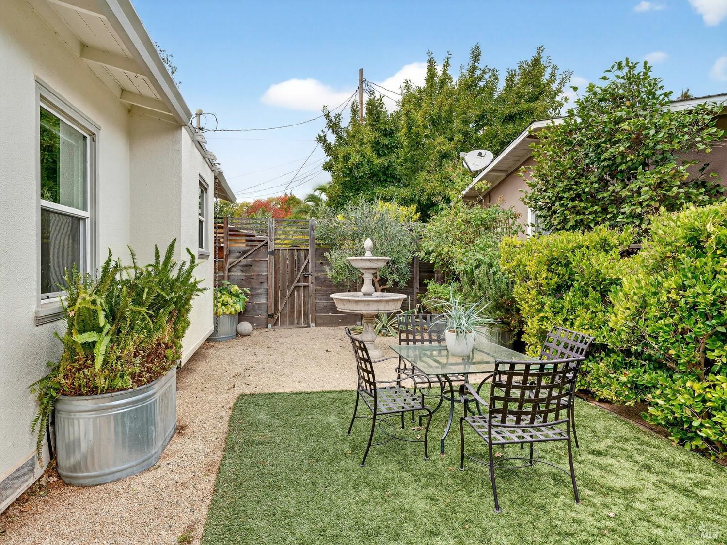 2 Bulson Court Napa, CA 94559 - Photo 12 of 30 a view of a backyard with chair and potted plants