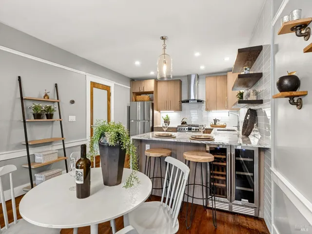 a kitchen with sink and refrigerator