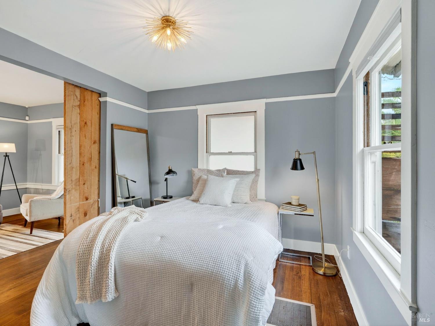 2 Bulson Court Napa, CA 94559 - Photo 25 of 30 a bedroom with a bed and a chandelier