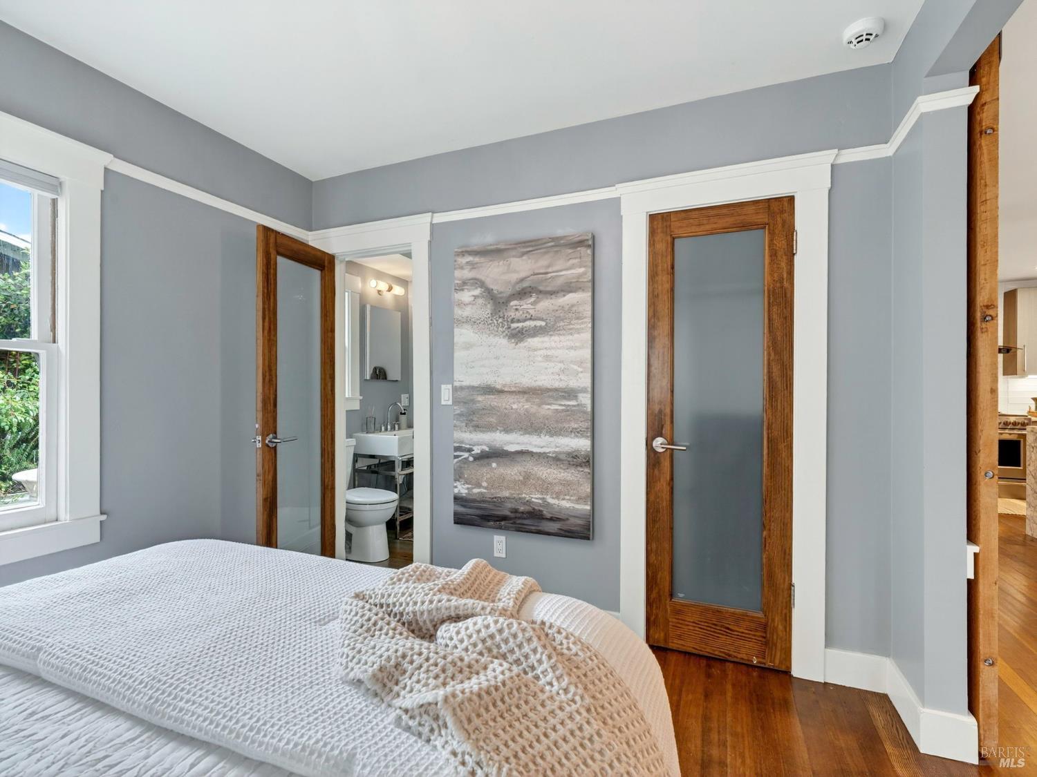 2 Bulson Court Napa, CA 94559 - Photo 26 of 30 a bedroom with a bed and wooden floor