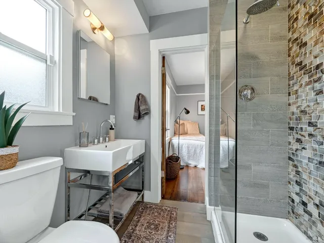 a bathroom with a sink toilet and shower