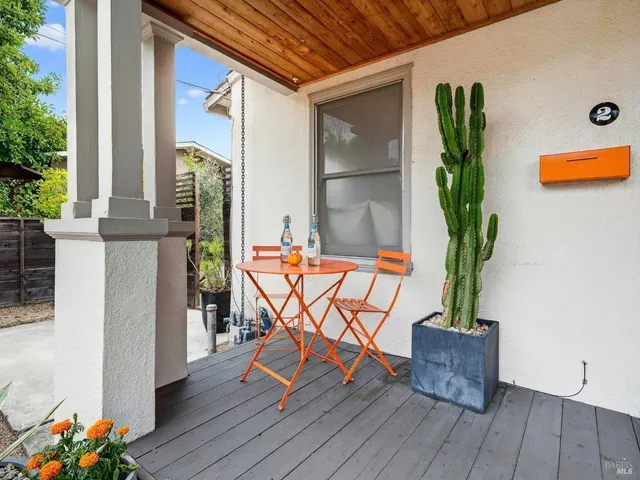 a view of a chairs and table in backyard of the house