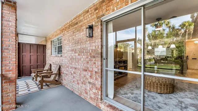 a balcony with table and chairs