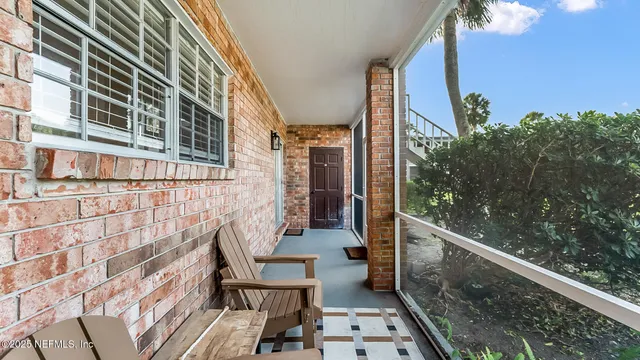 a view of balcony with furniture