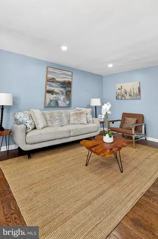 a living room with furniture and a rug