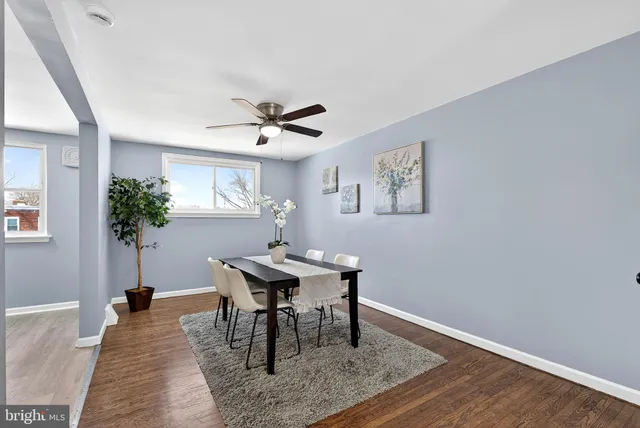 a view of a work space with furniture and a potted plant