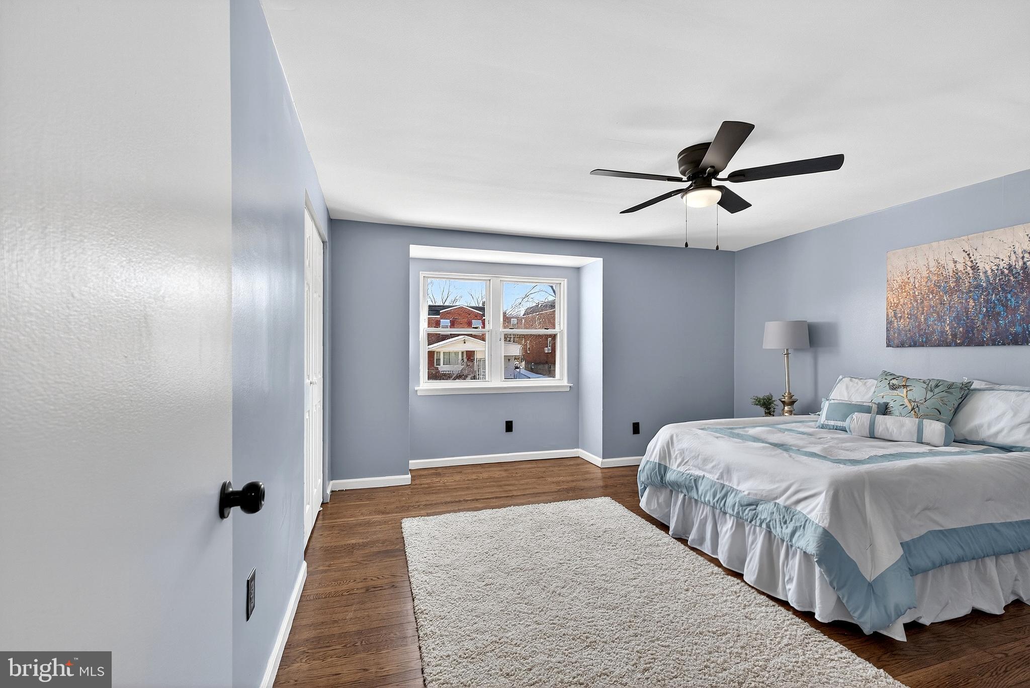 1216 Harshaw Road Brookhaven, PA 19015 - Photo 19 of 38 a bedroom with a large bed and a chandelier