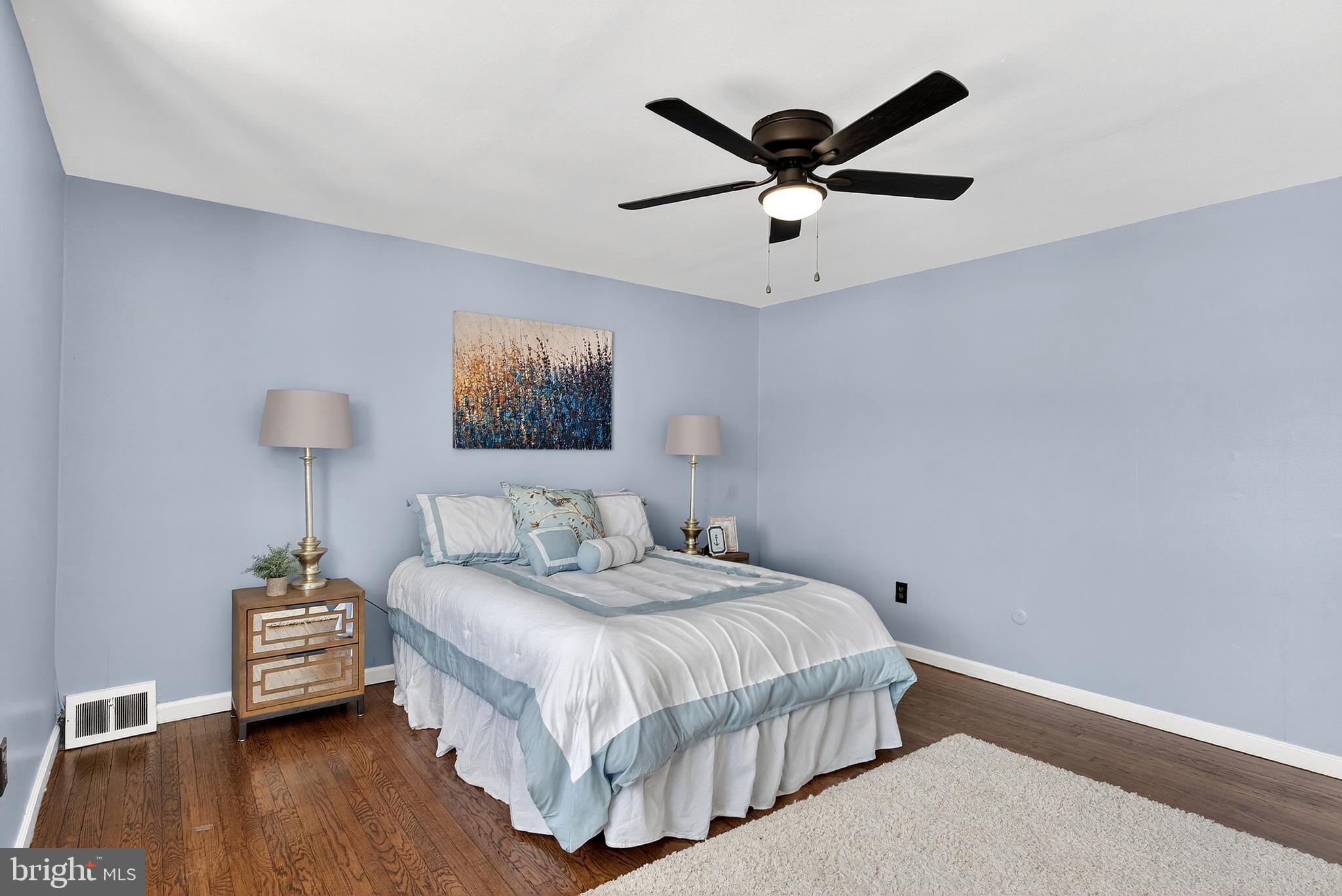 1216 Harshaw Road Brookhaven, PA 19015 - Photo 21 of 38 a bedroom with a bed and a ceiling fan
