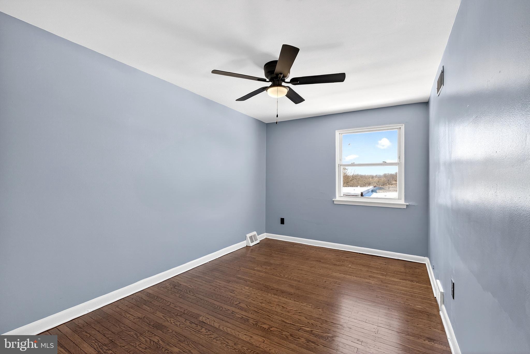 1216 Harshaw Road Brookhaven, PA 19015 - Photo 27 of 38 a view of empty room with wooden floor