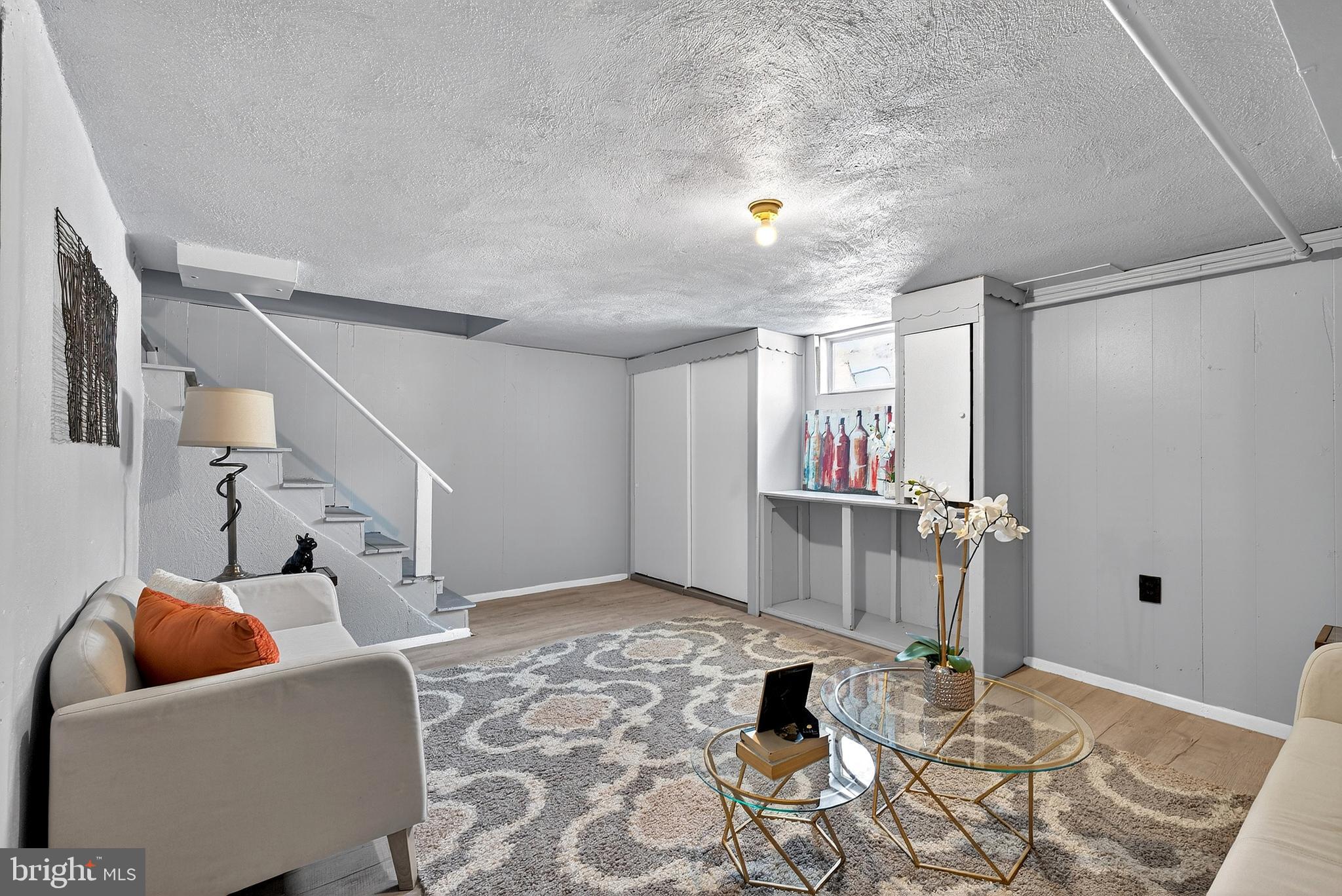 1216 Harshaw Road Brookhaven, PA 19015 - Photo 32 of 38 a living room with furniture and a window