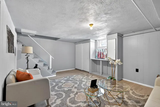 a living room with furniture and a window