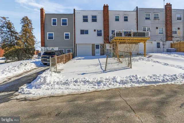 a swimming pool with outdoor seating