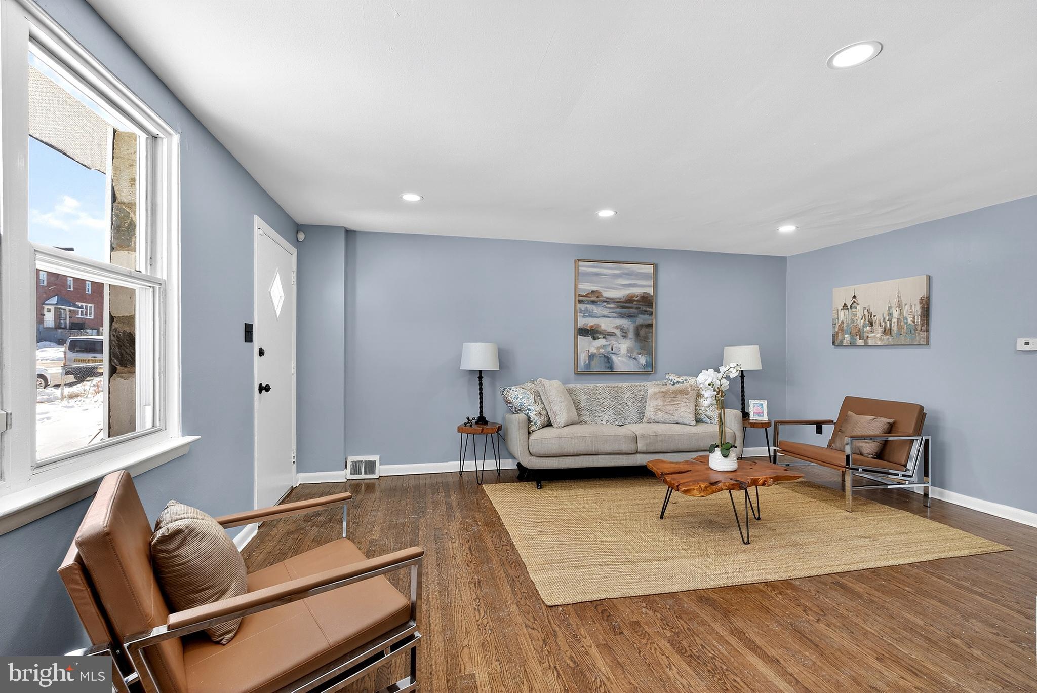 1216 Harshaw Road Brookhaven, PA 19015 - Photo 6 of 38 a living room with furniture and a wooden floor