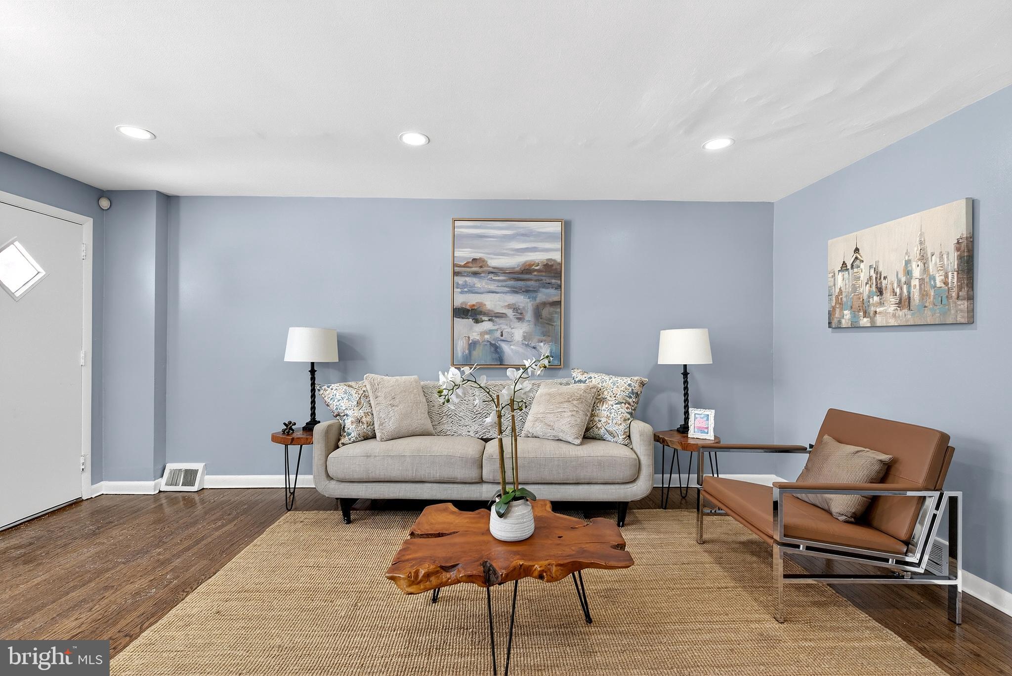 1216 Harshaw Road Brookhaven, PA 19015 - Photo 7 of 38 a living room with furniture a lamp and a rug