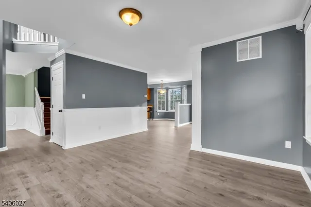 a view of a livingroom with wooden floor