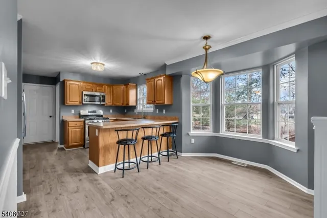 a dining room with furniture window wooden floor