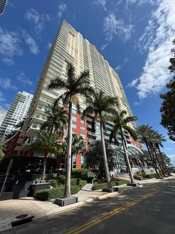 a kitchen with kitchen island a sink stainless steel appliances and cabinets