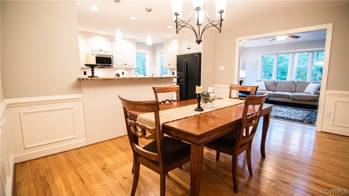 13919 Bayport Landing Road Midlothian, VA 23112 - Photo 8 of 38 Dining Room with Bronze Chandelier and Hardwood Fl