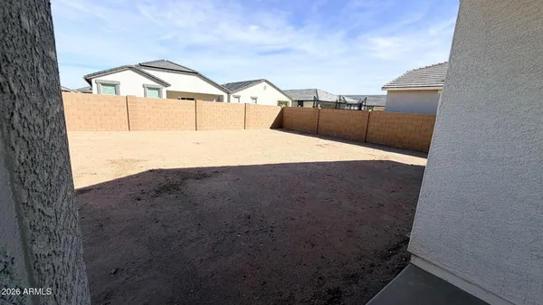 a house view with a backyard space