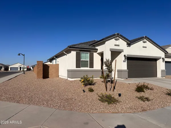 a front view of a house with backyard