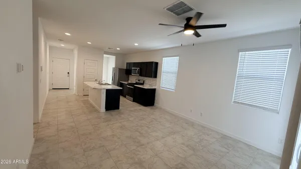 a open kitchen with cabinets and stainless steel appliances