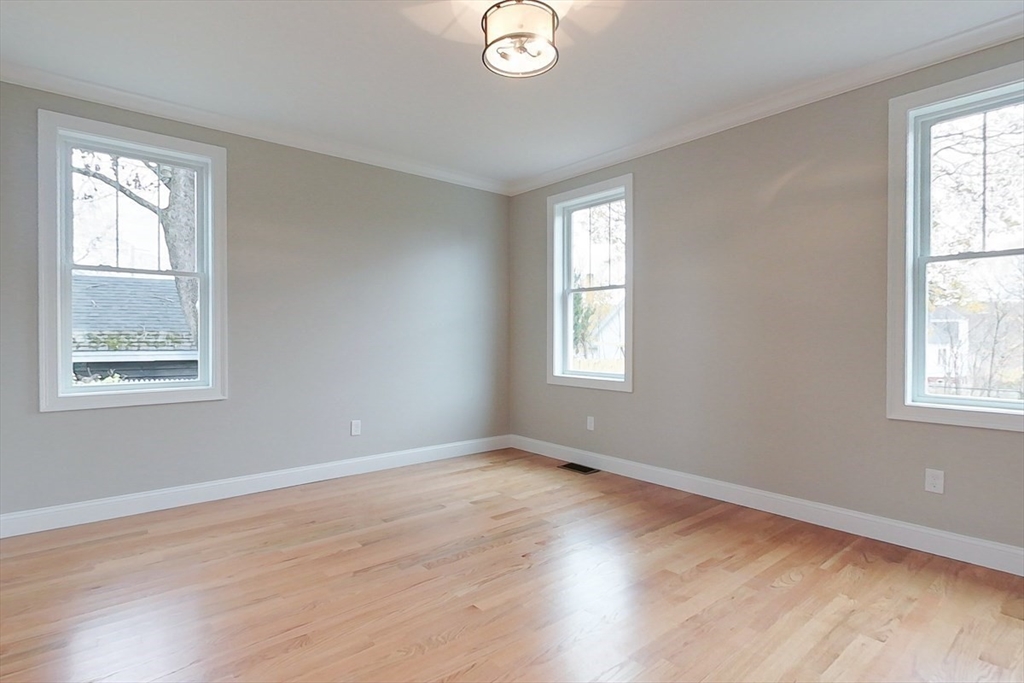 10 Pleasant Street Templeton, MA 01436 - Photo 15 of 41 a view of an empty room with wooden floor and a window