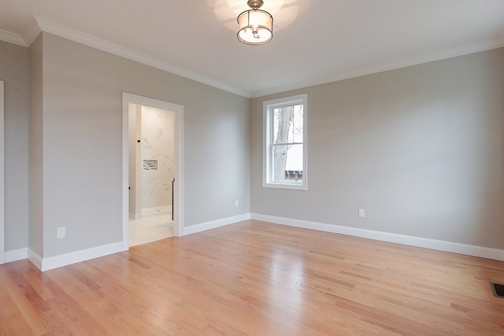 10 Pleasant Street Templeton, MA 01436 - Photo 16 of 41 a view of an empty room with window and wooden floor