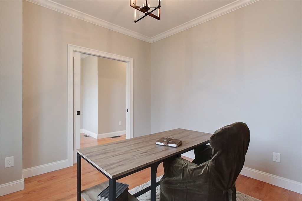 10 Pleasant Street Templeton, MA 01436 - Photo 21 of 41 a view of a workspace area with furniture and wooden floor