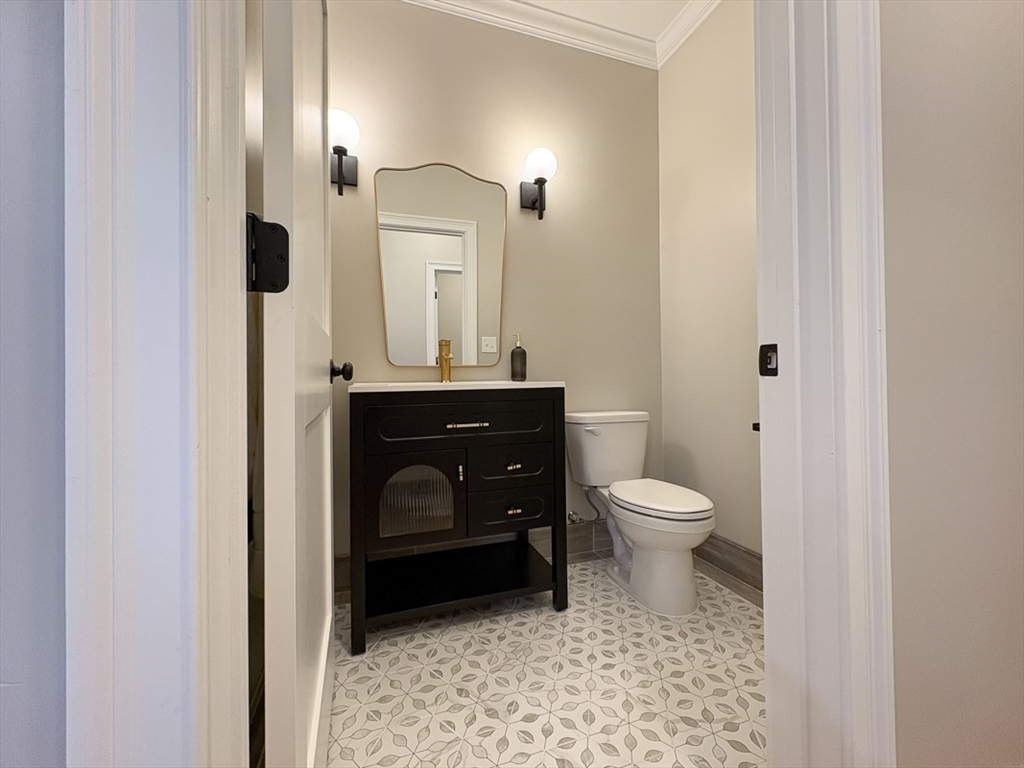 10 Pleasant Street Templeton, MA 01436 - Photo 22 of 41 a bathroom with a toilet a sink and mirror