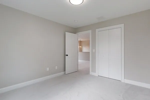 a view of an empty room and a window