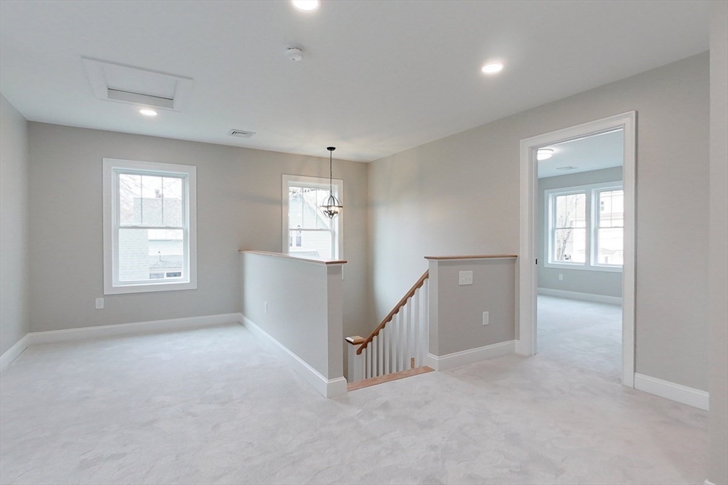 10 Pleasant Street Templeton, MA 01436 - Photo 30 of 41 an empty room with windows and pillars in it