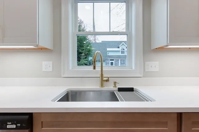 a kitchen with a sink and a window