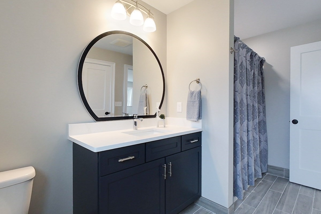 10 Pleasant Street Templeton, MA 01436 - Photo 32 of 41 a bathroom with a sink a toilet and a mirror