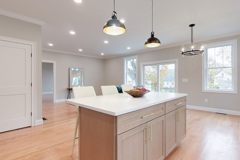 10 Pleasant Street Templeton, MA 01436 - Photo 6 of 41 a kitchen with a sink chandelier and wooden floor