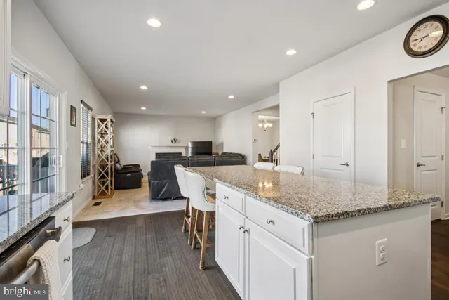 a bathroom with a sink mirror and toilet