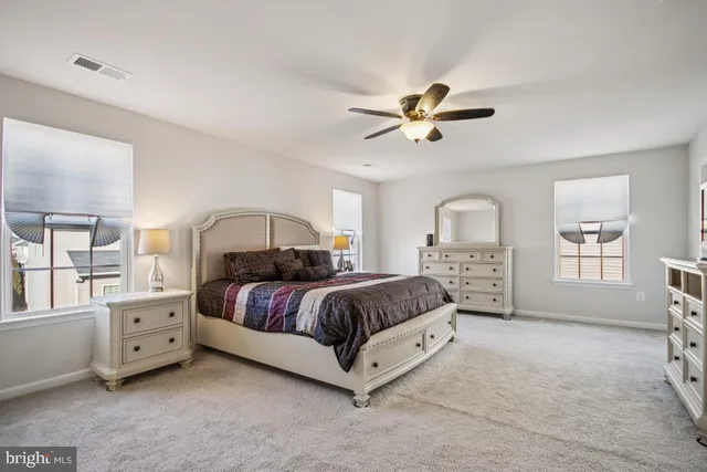 a bathroom with a toilet a sink and a mirror