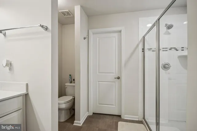a living room with furniture and a stairs