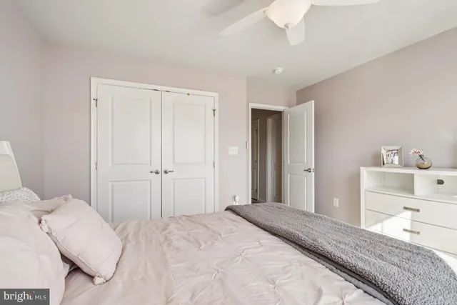 a living room with furniture a piano and a dining table
