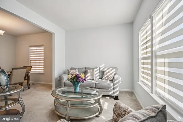 a view of a dining room with furniture and window