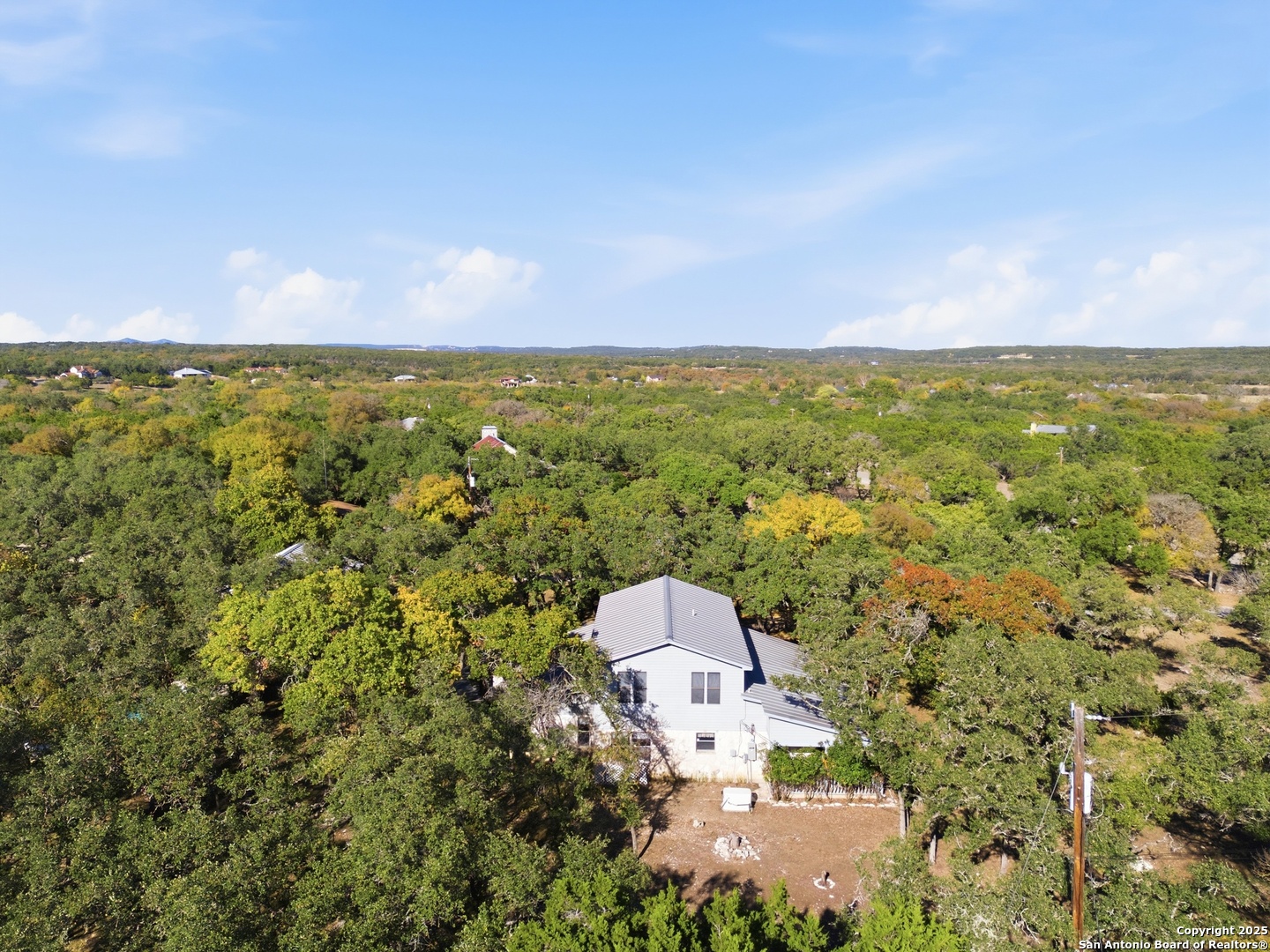 261 Fawn Lane Spring Branch, TX 78070 - Photo 33 of 36 an aerial view of a house with a yard