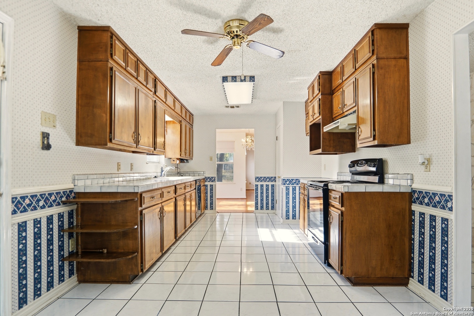 261 Fawn Lane Spring Branch, TX 78070 - Photo 6 of 36 a kitchen with stainless steel appliances a stove sink and cabinets