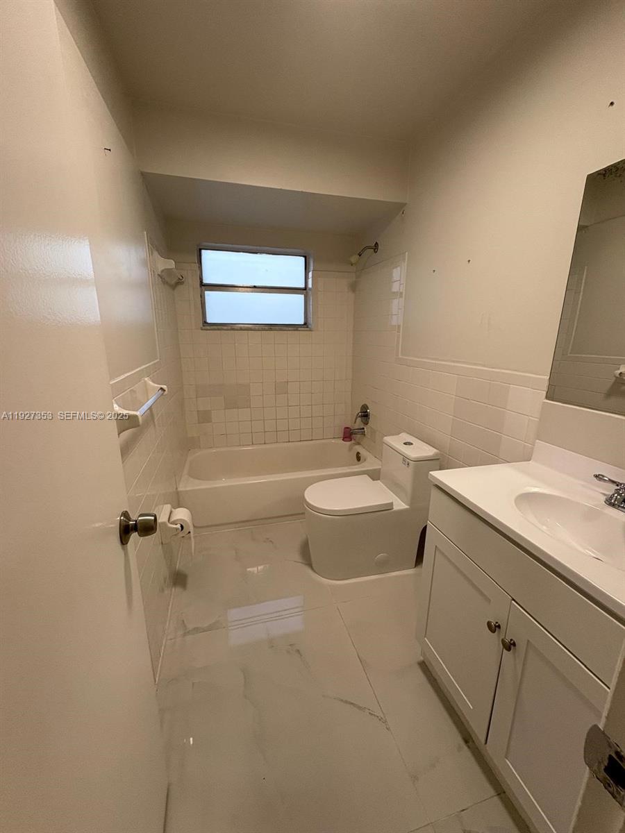 3821 Northwest 208th Street Miami Gardens, FL 33055 - Photo 13 of 23 a bathroom with a sink and mirror