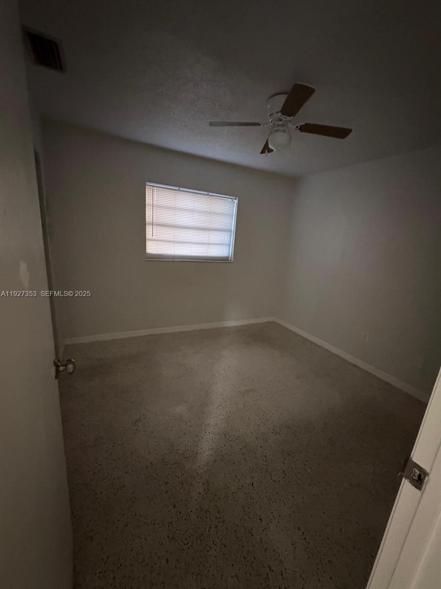3821 Northwest 208th Street Miami Gardens, FL 33055 - Photo 16 of 23 an empty room with a window